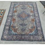 A Tabriz rug, profusely decorated with flora and foliage, on a multi-coloured ground  54" x 88"