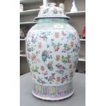 A late 19thC Chinese porcelain jar and cover, decorated in famille rose with floral sprigs  19"h