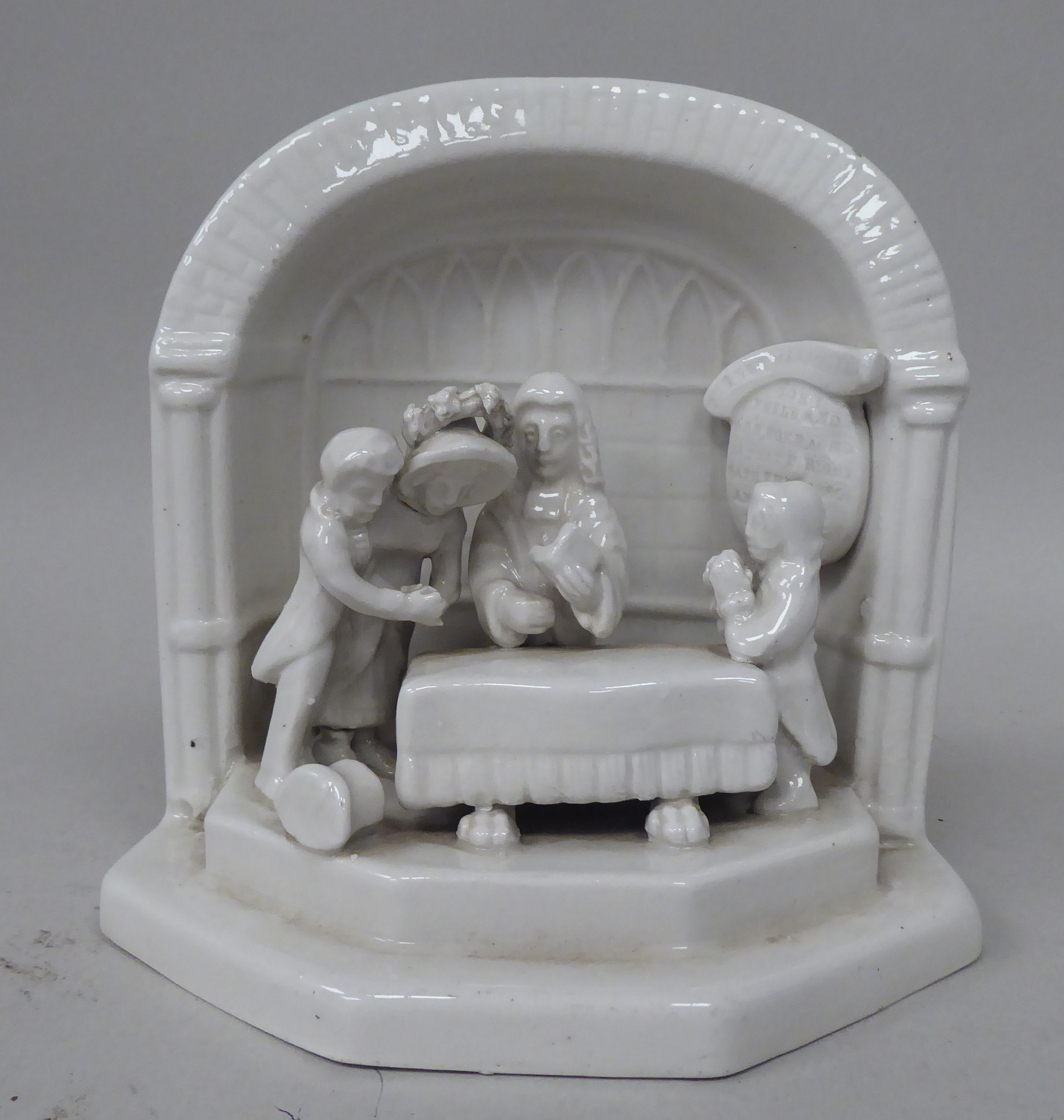 A slipware ornament, a couple, a clerk and the parson in a niche  6"h