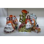 Staffordshire pottery ornaments: to include a woman seated beside a fox  13"h