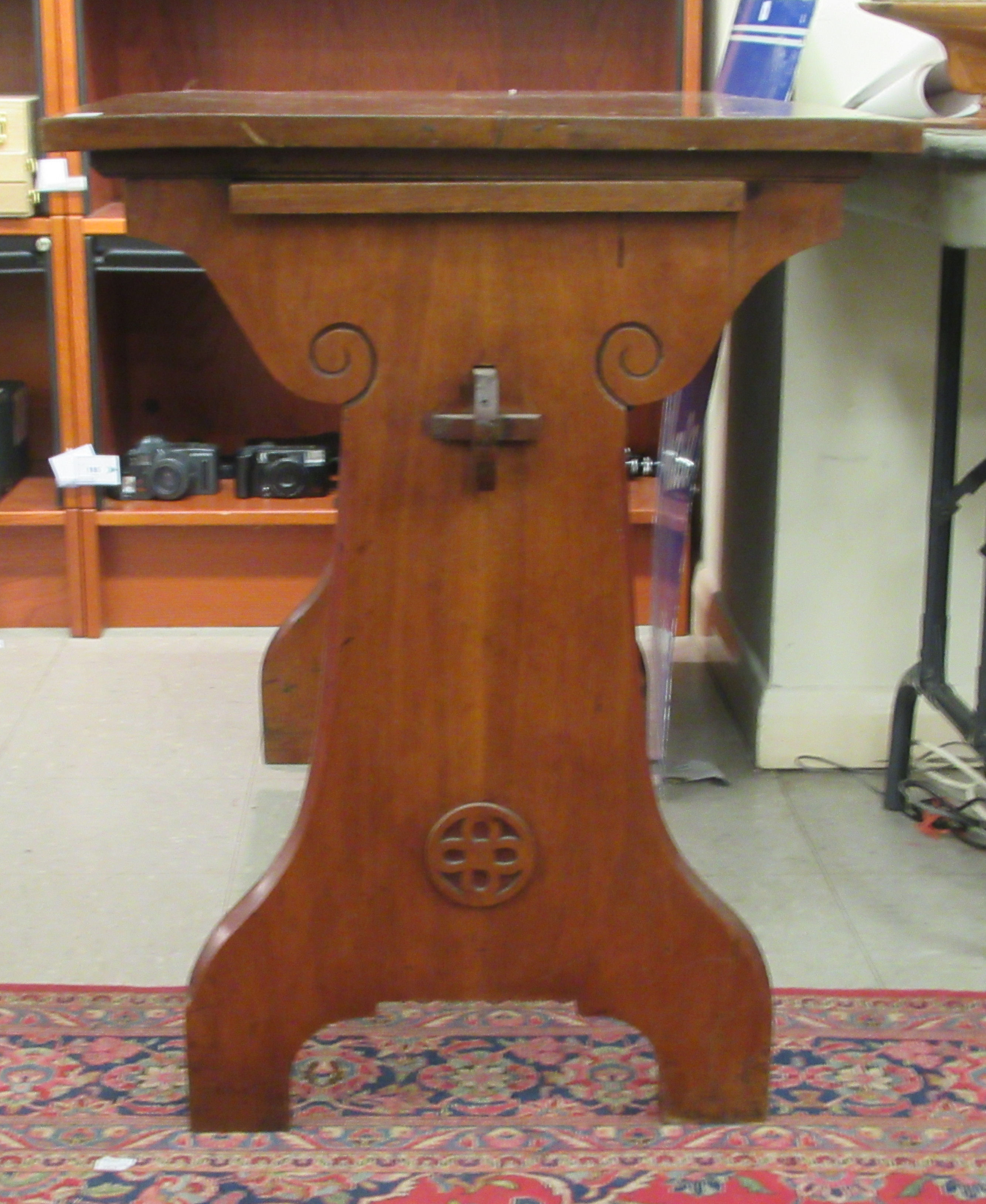 A late Victorian Gothic inspired mahogany hall table, raised on planted ends  30"h  42"w - Image 2 of 4