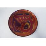A David-Andersen, Norway, enamelled copper wall plate, decorated in burnished colours with a