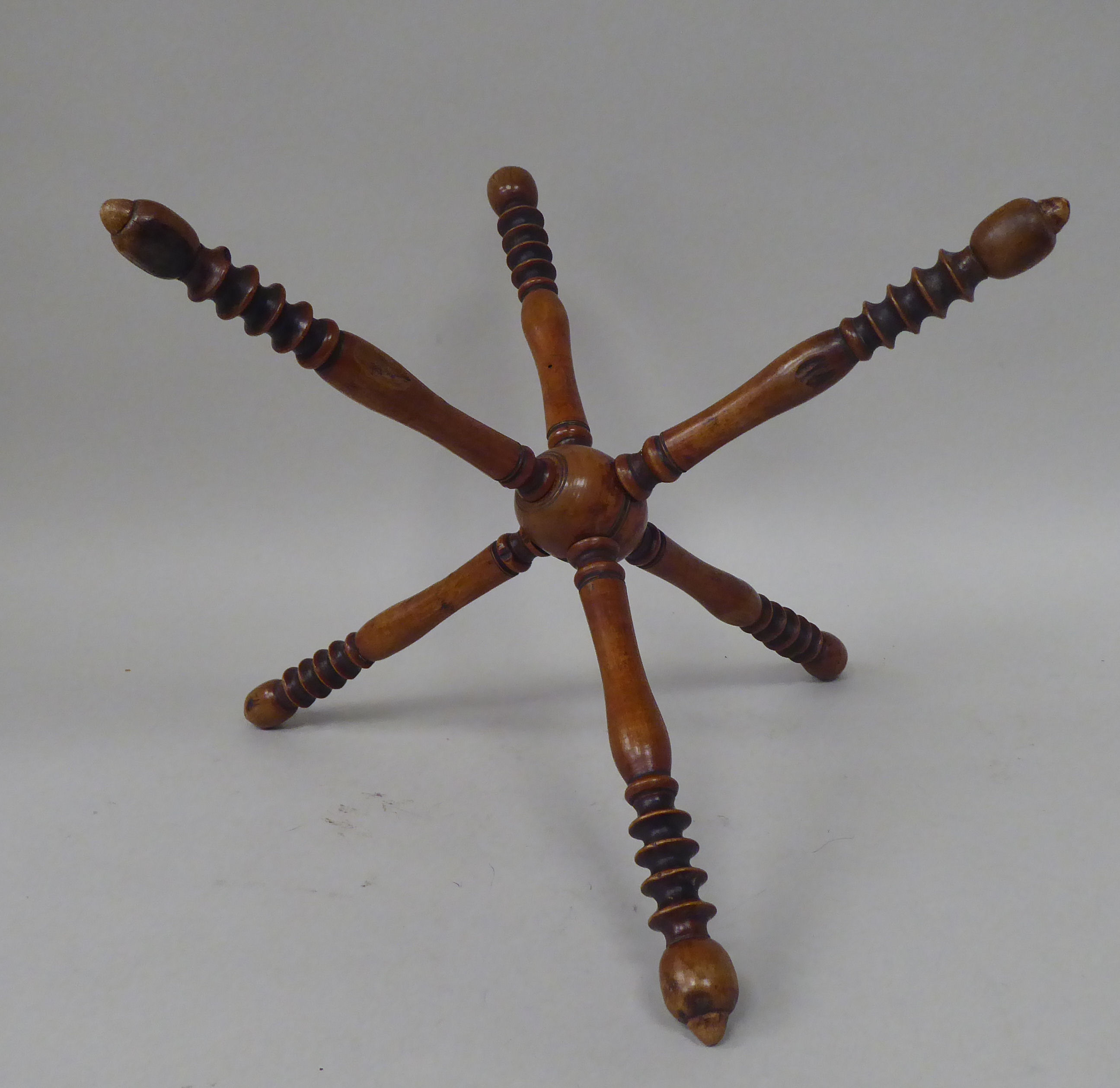 A late 19thC fruitwood wool winder, comprising six ring turned spindles, threaded to the central - Image 2 of 3