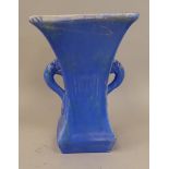 A CH Branman Ltd, Barnstaple blue/green glazed pottery, twin handled vase of waisted square form