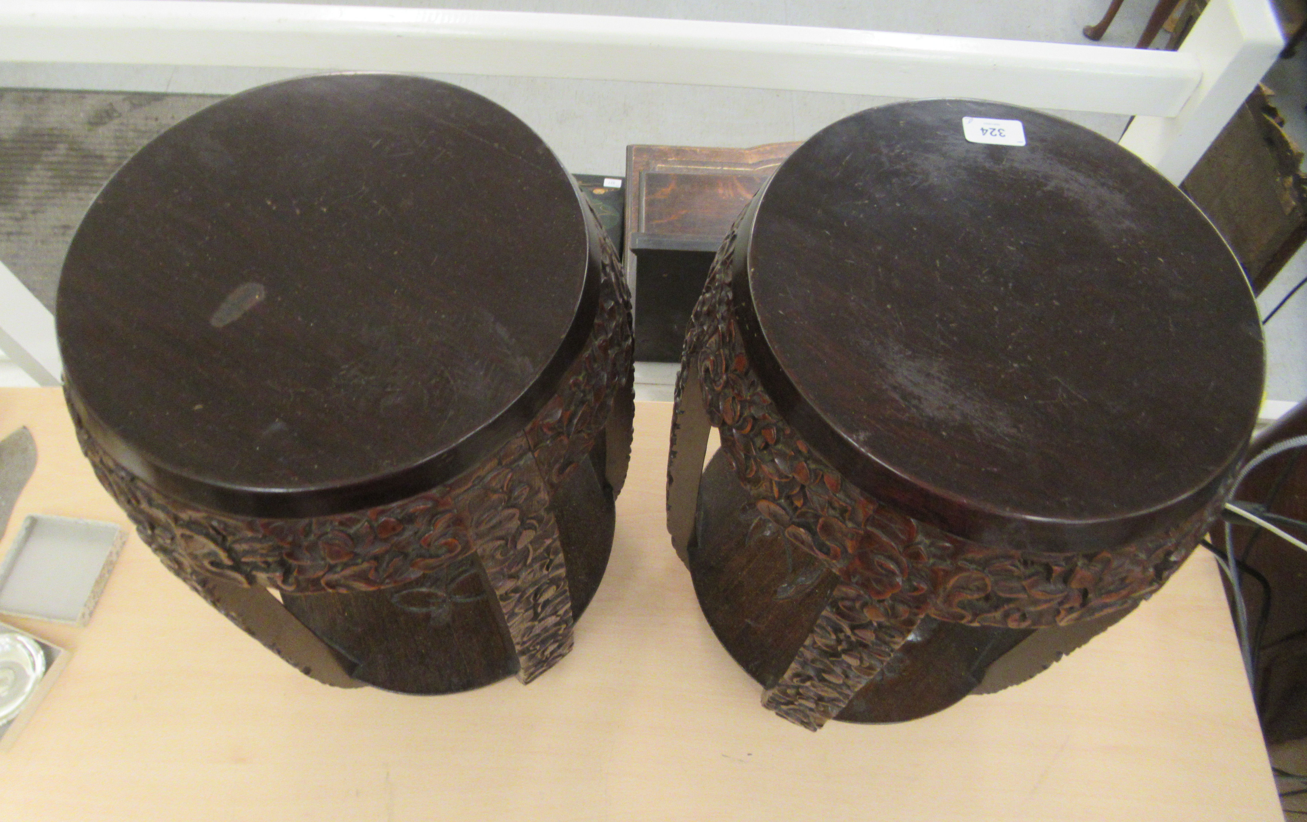 A pair of 20thC Japanese barrel design garden seats, profusely carved and densely decorated with - Image 3 of 5