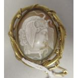 A yellow metal framed cameo brooch