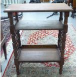 An Arts & Crafts oak Moorish style bookstand by Leonard Wyburd for Liberty & Co with a level table