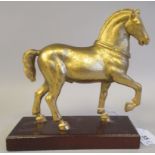 A 20thC gilded metal model horse, on a plinth  6"h