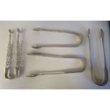 Four pairs of silver sugar tongs  mixed designs & marks