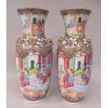 A pair of late 19thC Canton porcelain vases, decorated with cartouches depicting garden scenes  10"h