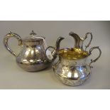 A late Victorian style silver plated, three piece tea set  comprising teapot, sugar basin and