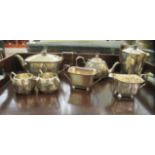 A four piece silver plated tea set; and a three piece silver plated tea set