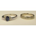A 14ct white gold diamond half eternity ring; and a 14ct white gold diamond and sapphire ring