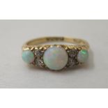 An 18ct gold opal and diamond ring