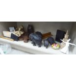 A mixed lot: to include a glass paperweight; and carved wooden animals