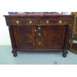 A William IV mahogany sideboard with a pair of inline drawers and three short central box drawers,