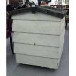 A white painted wooden beehive  34"h  28"sq