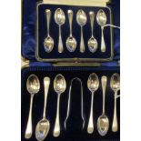 A set of six silver Hanoverian rattail pattern coffee spoons  cased; and a set of six silver