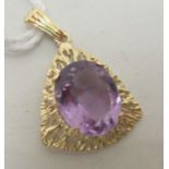 A 9ct gold pendant, set with an amethyst