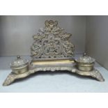 A Victorian style brass deskstand, incorporating a letter rack, a pen channel and a pair of