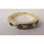 An 18ct gold sapphire and diamond eternity ring