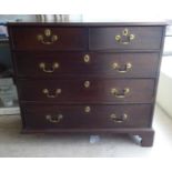 A 19thC oak dressing chest, comprising two short/three long drawers with brass bail handles,