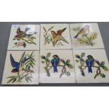 A set of six early 20thC Minton pottery tiles, each depicting a different bird in bright colours