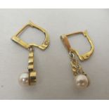 A pair of yellow metal pearl drop earrings
