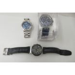 Three variously cased and strapped Swatch wristwatches