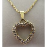 An 18ct gold and diamond set heart shape pendant, on a fine neckchain and ring bolt clasp