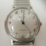 A stainless steel cased and strapped Omega wristwatch, faced by an Arabic dial