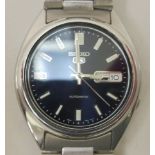 A Seiko 5 stainless steel cased and strapped automatic wristwatch, faced by a baton dial with a