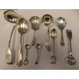 Silver flatware: to include a shovel design caddy spoon; a sauce ladle with a round bowl; and a