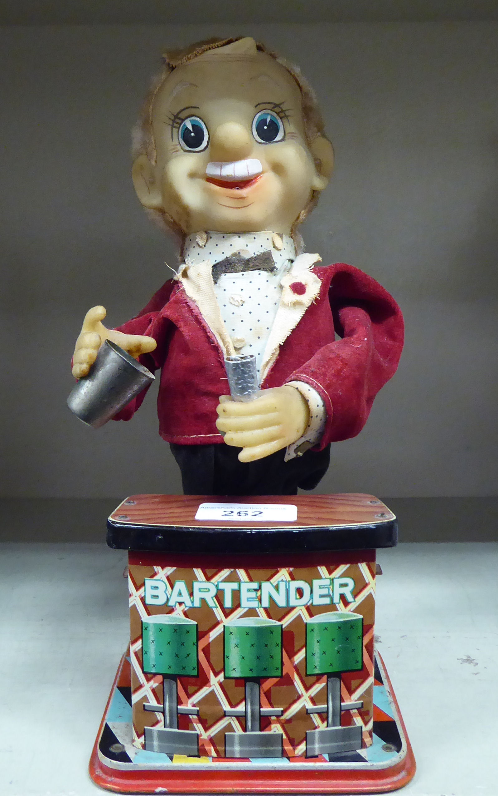 A vintage painted tinplate, battery operated mechanical toy 'The Bartender'  11.5"h