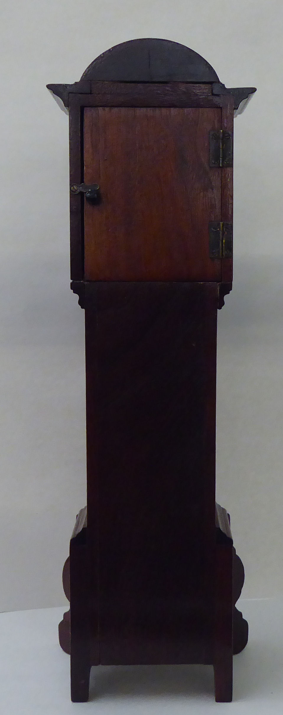 An early 20thC mahogany mantel timepiece, fashioned as a longcase clock with an arched hood and - Image 3 of 4