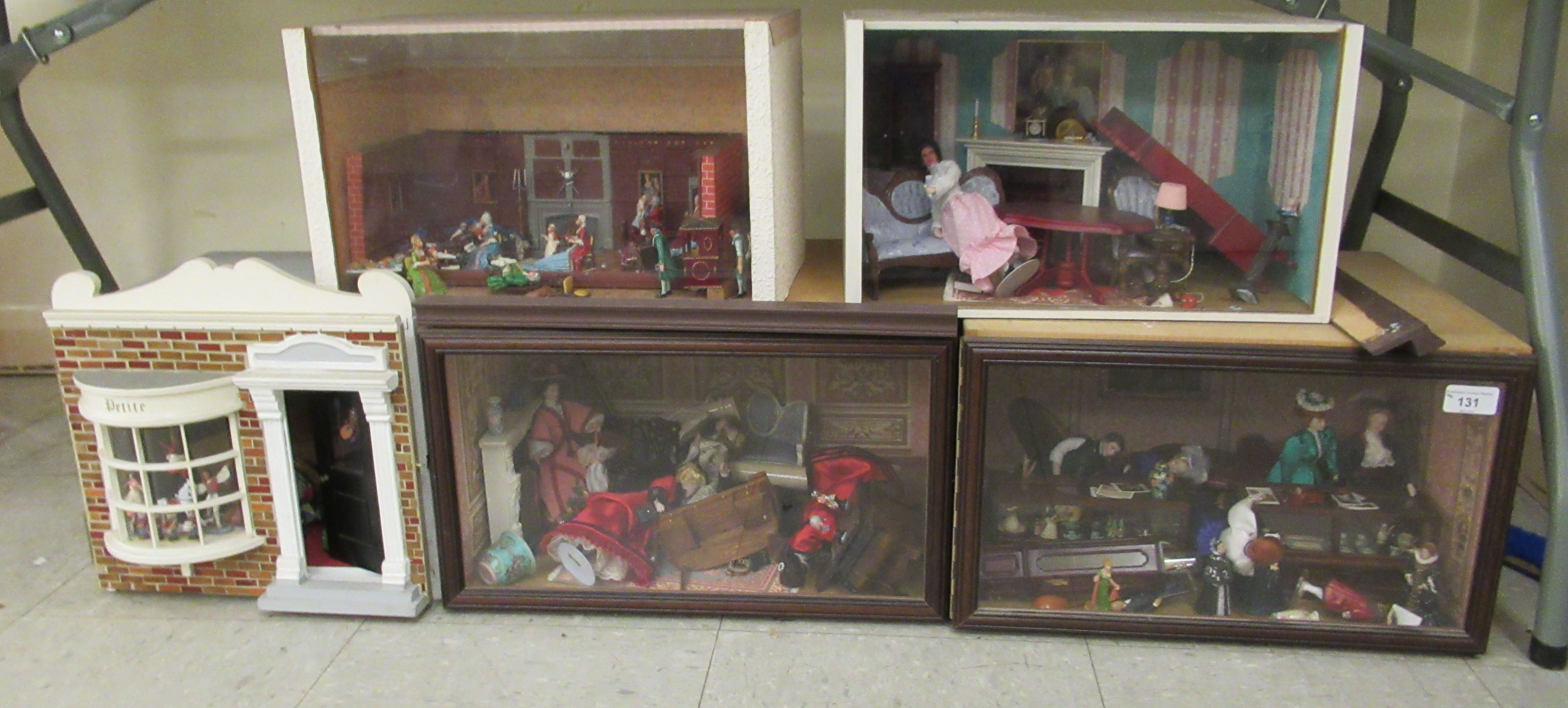 Five dolls house room settings, containing figures, furniture and accessories  cased  largest 11"