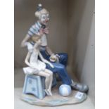 A Lladro porcelain group, a clown seated beside a ballerina  13.5"h