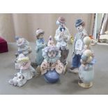 Seven Lladro porcelain clown themed figures: to include one playing a saxaphone  7"h