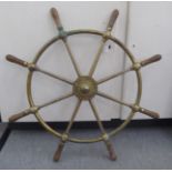 A 20thC brass ships wheel with turned wooden handles  bears impressed marks 'Brown Brothers,