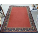 A machine made Persian design rug, on a multi-coloured ground  66" x 88"