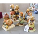 Six Goebel china figures: to include a girl at a chalk board  4"h