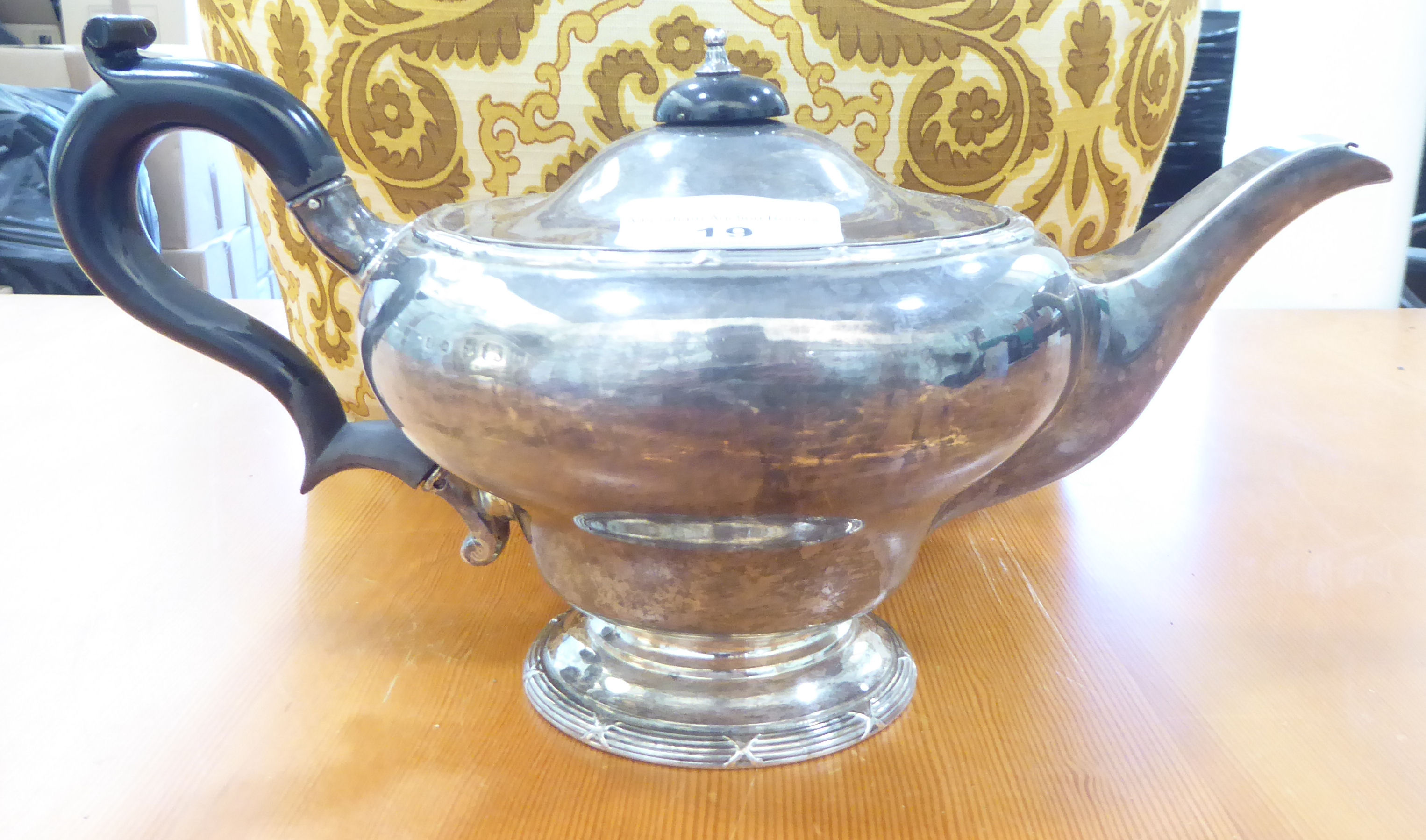 A George V silver teapot of bulbous form on a pedestal foot  Birmingham 1912 with a fabric tea - Image 3 of 5