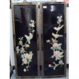 A pair of modern, black lacquered chinoiserie panels, decorated with resin floral and birds  each