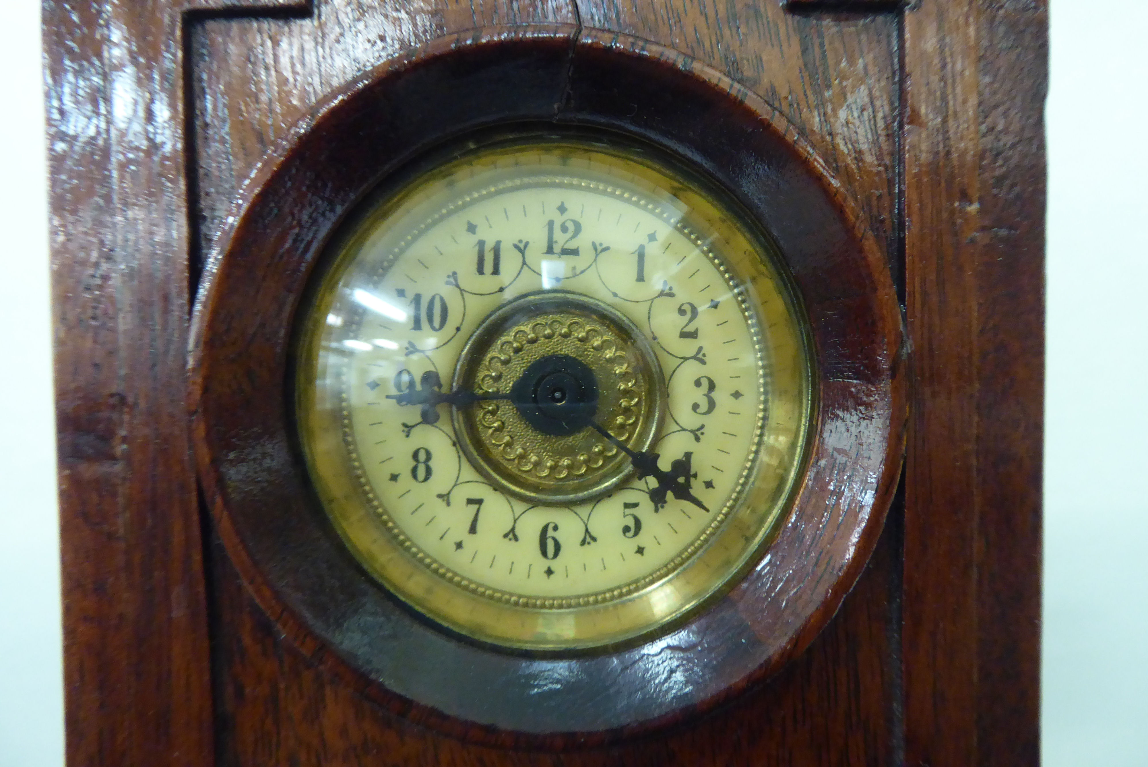 An early 20thC mahogany mantel timepiece, fashioned as a longcase clock with an arched hood and - Image 2 of 4