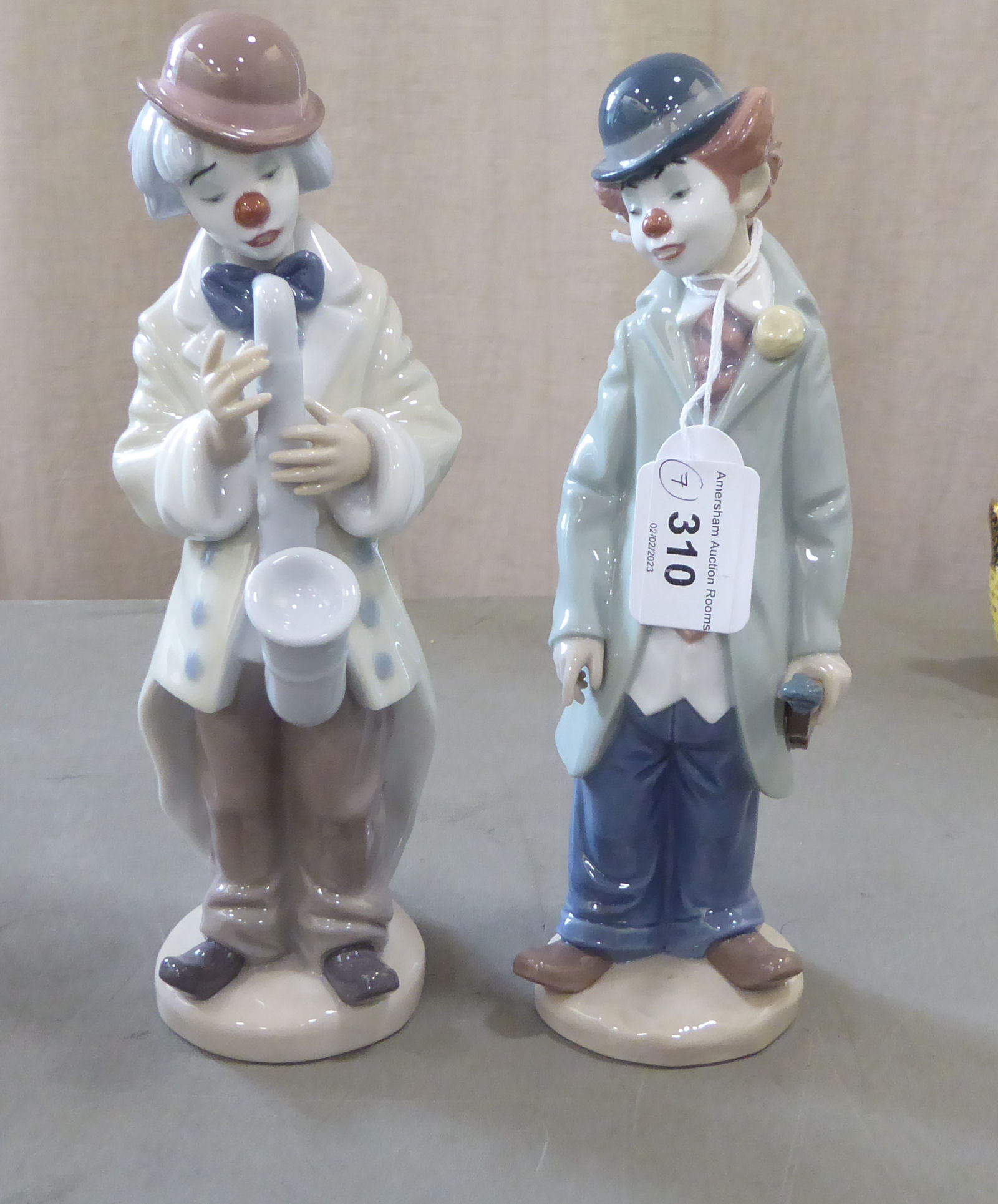 Seven Lladro porcelain clown themed figures: to include one playing a saxaphone  7"h - Image 2 of 5