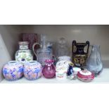 Decorative ceramics and glassware: to include a clear and cranberry coloured vase  10.5"h