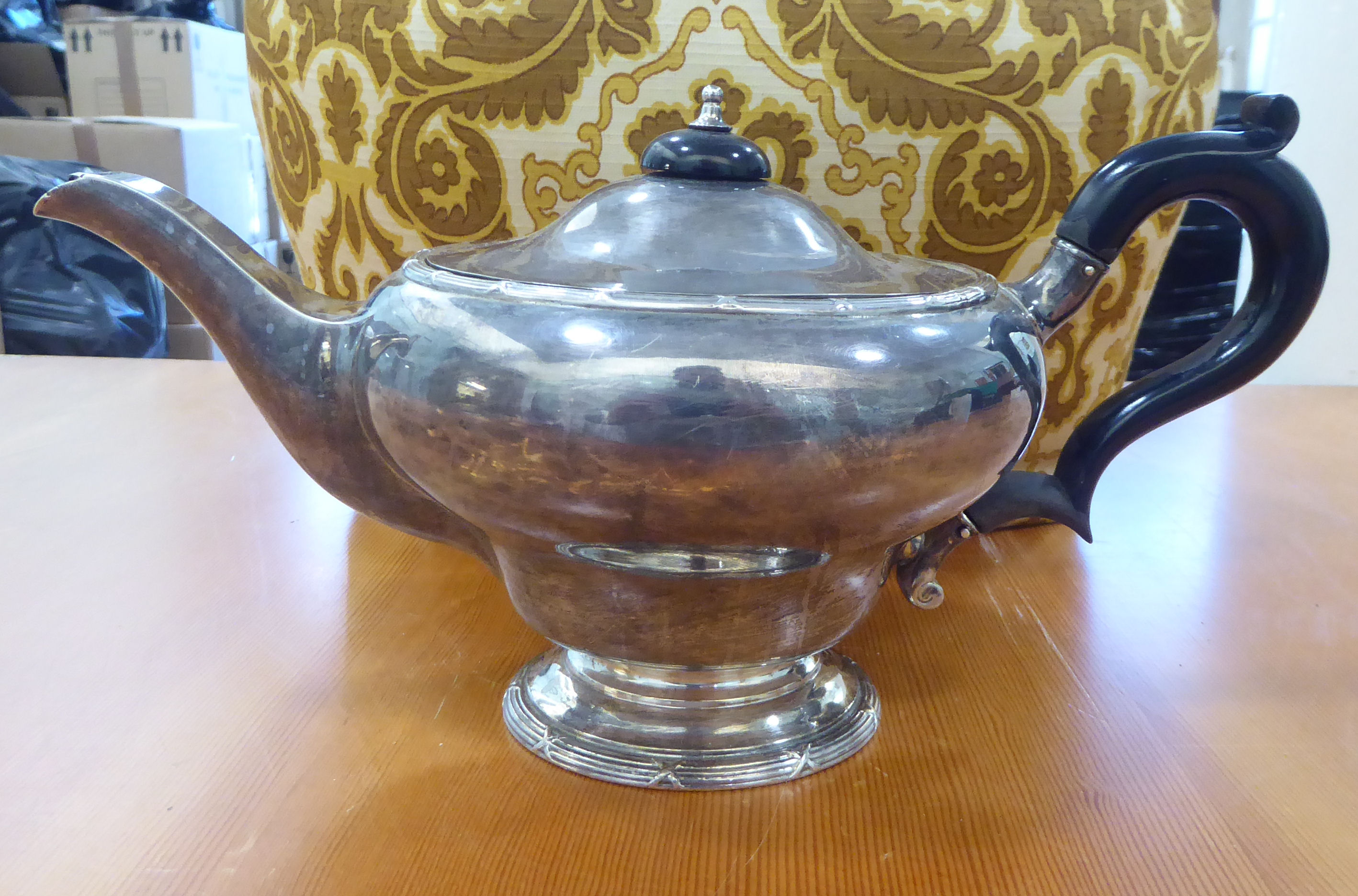 A George V silver teapot of bulbous form on a pedestal foot  Birmingham 1912 with a fabric tea - Image 4 of 5