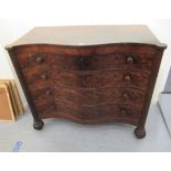 A late Regency mahogany serpentine front dressing chest with four graduated long drawers, raised