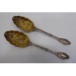 A pair of late Victorian silver plated berry spoons