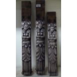 Three late 19thC carved oak furniture mounts, each depicting a standing native figure  approx. 24"h